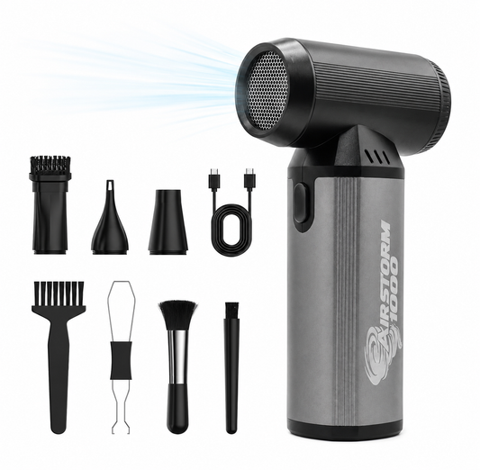 AirStorm 1000 air duster with its full accessory kit laid out: three nozzles, three cleaning brushes, a wire keycap puller, and a USB-C charging cable